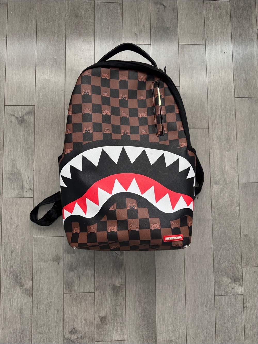 Sprayground Brown Checker Shark-Mouth Backpack with Red & White Accent